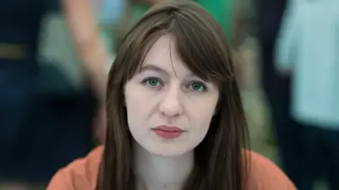 Sally Rooney claims she will not enter the UK over potential arrest